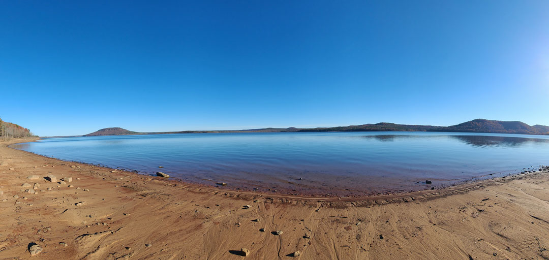 Sandy beach panorama across Greers Ferry Lake near Bay Shore Estates